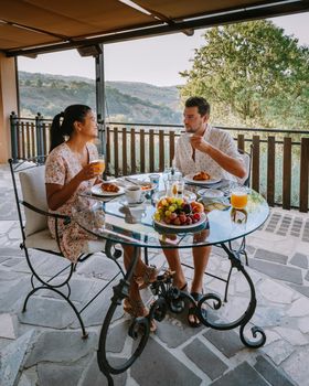 couple having breakfast at luxury villa at the Italian country side near Rome Italy. 