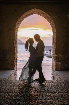 Cefalu, the medieval village of Sicily island, Province of Palermo, Italy. Europe, a couple on vacation at the Italian Island Sicilia