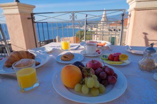 Taormina Sicily Italy breakfast table with a rooftop view over Taormina breakfast with coffee bread and fruit