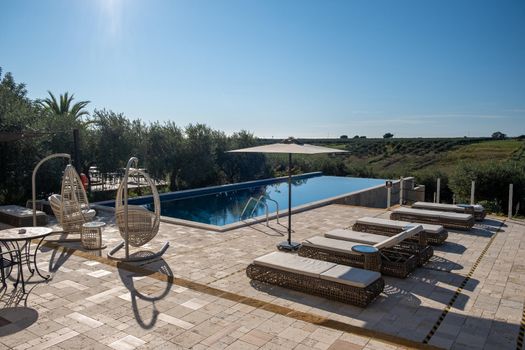 Luxury resort with a view over the wine field in Selinunte Sicily Italy. infinity pool with a view over wine fields in Sicilia