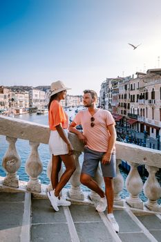 couple men and woman on a city trip to Venice Italy, colorful streets with canals Venice. Europe