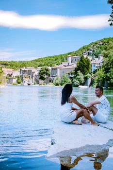 couple on vacation in Ardeche France, view of the village of Vogue in Ardeche. France Europe