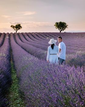 Couple men and woman on vacation at the provence lavender fields,