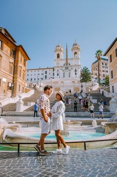 The Spanish Steps in Rome, Italy. The famous place is a great example of Roman Baroque Style. Italy couple on city trip in Rome