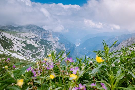 hiking in the italian dolomites during foggy weather with clouds, Stunning view to Tre Cime peaks in Dolomites, Italy. Europe