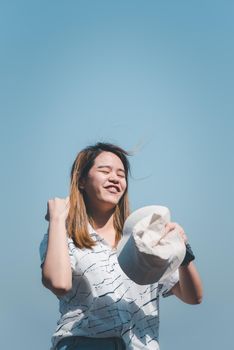 Asian pretty cute woman with hat relax at seaside city landscape viewpoint on mountain with happy and freedom emotion in concept travel, vacation, leisure in life