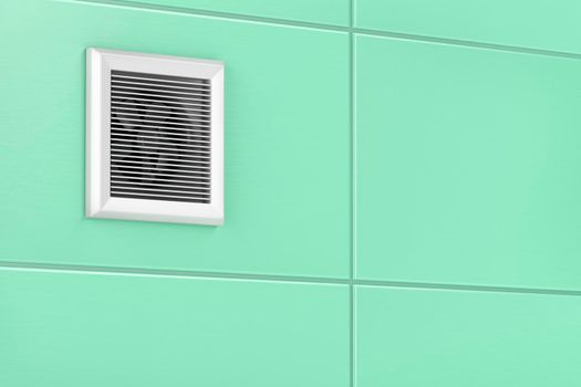 Exhaust fan mounted on the tiles in the bathroom