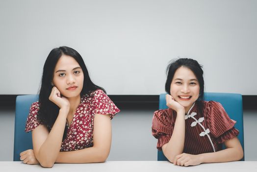 Asian pretty women in cheongsam chinese style great happy joyful and coworker discussion in meeting room in office with happy and smile in concept success, winner, successful or business