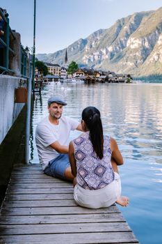 couple visit during summer vacation Hallstatt village on Hallstatter lake in Austrian Alps Austria Europe