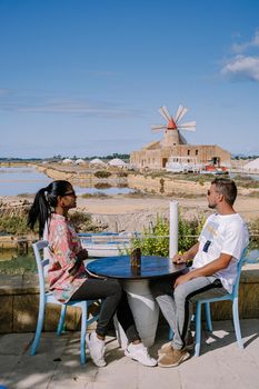 Salt Pans near Marsala, Sicily at Italy in Europe, couple visit Marsala Sicilia