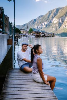 couple visit during summer vacation Hallstatt village on Hallstatter lake in Austrian Alps Austria Europe