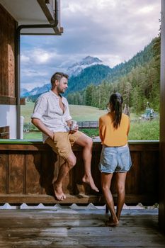 couple on vacation in the, Dolomites Italy, small church during cloudy foggy weather, San Vigilio di Marebbe,South Tirol,Italy San Vigilio di Marebbe small town in Dolomites mountain Europe