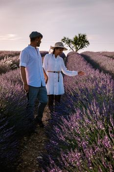 Provence, Lavender field France, Valensole Plateau, colorful field of Lavender Valensole Plateau, Provence, Southern France. Lavender field. Europe. Couple men and woman on vacation at the provence lavender fields,