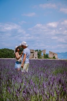 Provence, Lavender field France, Valensole Plateau, colorful field of Lavender Valensole Plateau, Provence, Southern France. Lavender field. Europe. Couple men and woman on vacation at the provence lavender fields,