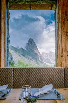  hiking in the Italien Dolomites, Amazing view on Seceda peak. Trentino Alto Adige, Dolomites Alps, South Tyrol, Italy, Europe. Odle mountain range, Val Gardena. Majestic Furchetta peak in morning sunlight. Italy