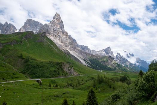 Pale di San Martino from Baita Segantini - Passo Rolle italy,Couple visit the italian Alps, View of Cimon della Pala, the best-know peak of the Pale di San Martino Group in the Dolomites, northern Italy Europe