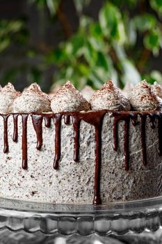 Round creamy cake with chocolate and cinnamon