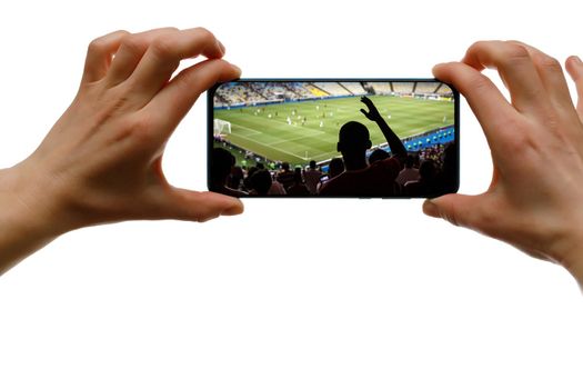 The concept of broadcasting sports on a mobile phone. Smartphone in female hands on an isolated white background