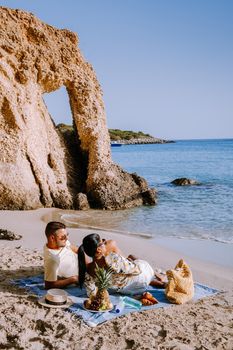 Tropical beach of Voulisma beach, Istron, Crete, Greece ,Most beautiful beaches of Crete island -Istron bay near Agios Nikolaos young couple mid age on vacation in Greece Crete