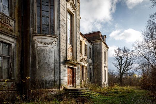 Old abandoned palace, manor in the autumn forest