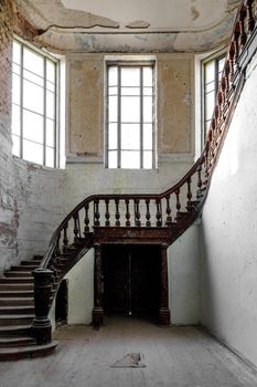 A carved wooden staircase in ancient palace