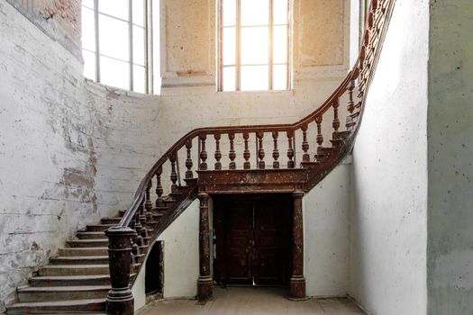 A carved wooden staircase in ancient palace