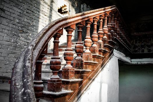 Old wooden railing of a vintage staircase