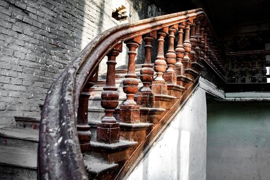 Old wooden railing of a vintage staircase