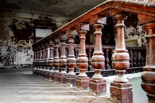 Old wooden railing of a vintage staircase