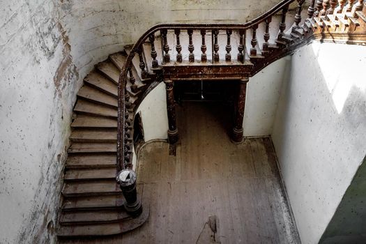 A carved wooden staircase in ancient palace