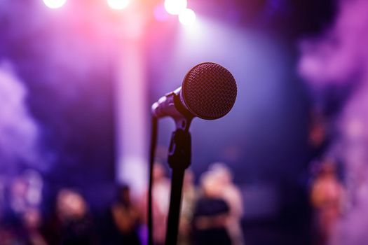 Microphone head on stage in a dark room