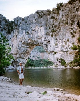  guy on vacation in the Ardeche France Pont d Arc, Ardeche France,view of Narural arch in Vallon Pont D'arc in Ardeche canyon in France Europe