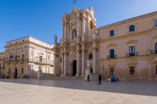 Ortigia in Syracuse Sicily Italy October 2020 in the Morning. Travel Photography from Syracuse, Italy on the island of Sicily. Cathedral Plaza and market with people wearing face protection during the 2020 pandemic covid 19 corona virus