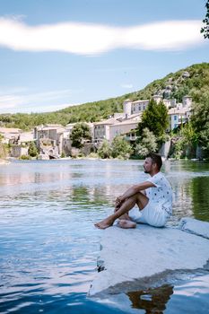 guy on vacation in Ardeche France, view of the village of Vogue in Ardeche. France Europe