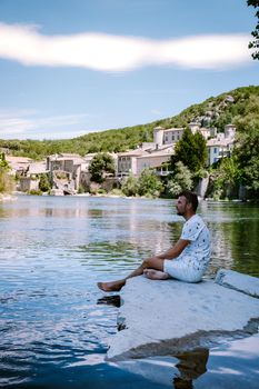 guy on vacation in Ardeche France, view of the village of Vogue in Ardeche. France Europe
