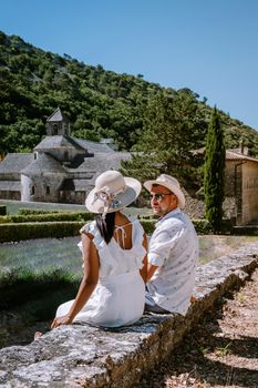 couple visit the old town of Gordes Provence,Blooming purple lavender fields at Senanque monastery, Provence, southern France. Europe