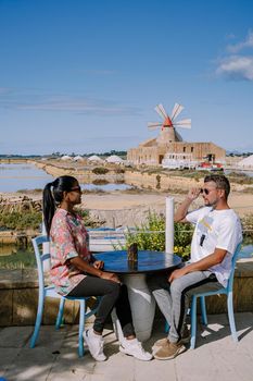 Salt Pans near Marsala, Sicily at Italy in Europe, couple visit Marsala Sicilia