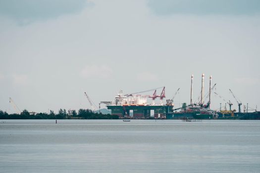 Oil and gas refinery plant near a beach in Batam Indonesia. Dangerous to the environment