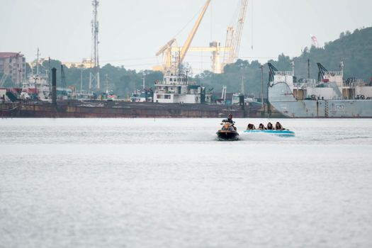 Beach water sports tubing with tourist being pulled by jetski in a beach in batam indonesia, Indonesia, May 4 2019