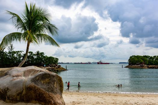 Siloso Sentosa Beach with White sand and tourists, Singapore, March 30, 2020