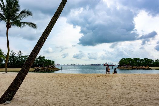 Siloso Sentosa Beach with White sand and tourists, Singapore, March 30, 2020