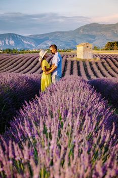 Provence, Lavender field France, Valensole Plateau, colorful field of Lavender Valensole Plateau, Provence, Southern France. Lavender field. Europe. Couple men and woman on vacation at the provence lavender fields,