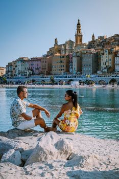 Menton France,couple men and woman on vacation at the Cote d Azur France, View on old part of Menton, Provence-Alpes-Cote d'Azur, France Europe