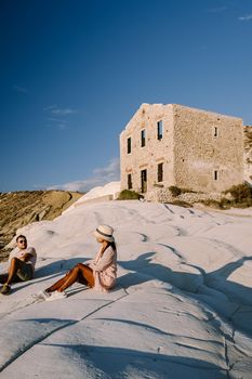 Punta Bianca, Agrigento in Sicily Italy White beach with old ruins of an abandoned stone house on white cliffs. Sicilia Italy, couple on vacation in Italy