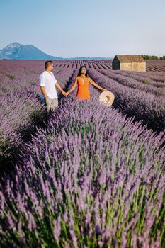 Provence, Lavender field France, Valensole Plateau, colorful field of Lavender Valensole Plateau, Provence, Southern France. Lavender field. Europe. Couple men and woman on vacation at the provence lavender fields,