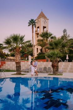 Crete Greece, Candia park village a luxury holiday village in Crete Greece by the ocean in traditional colors. Couple on vacation luxury resort