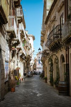 Ortigia in Syracuse Sicily Italy October 2020 in the Morning. Travel Photography from Syracuse, Italy on the island of Sicily. Cathedral Plaza and market with people wearing face protection during the 2020 pandemic covid 19 corona virus