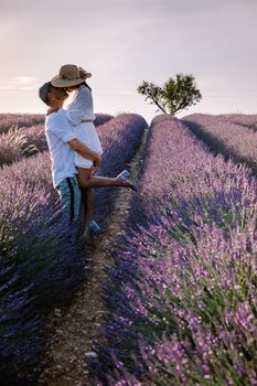 Provence, Lavender field France, Valensole Plateau, colorful field of Lavender Valensole Plateau, Provence, Southern France. Lavender field. Europe. Couple men and woman on vacation at the provence lavender fields,