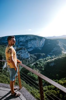  guy on vacation in the Ardeche France Pont d Arc, Ardeche France,view of Narural arch in Vallon Pont D'arc in Ardeche canyon in France Europe