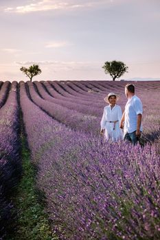 Provence, Lavender field France, Valensole Plateau, colorful field of Lavender Valensole Plateau, Provence, Southern France. Lavender field. Europe. Couple men and woman on vacation at the provence lavender fields,